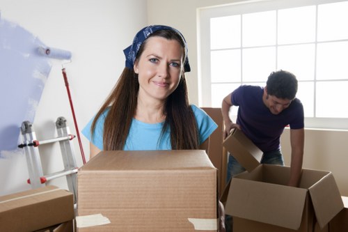 Professional movers packing boxes for a Streatham relocation