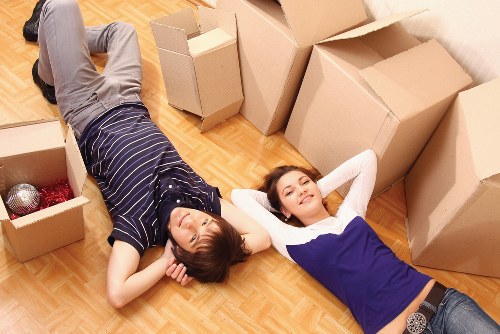 Professional movers packing boxes for a Streatham house move