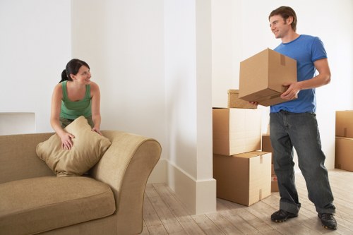 Packed moving boxes and furniture prepared for a Streatham relocation